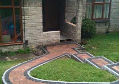 Stone Brick Porch Extensions with Brick Paved Walkway