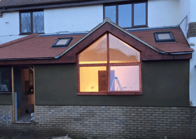 Outside House Extension with Large Abstract Windows